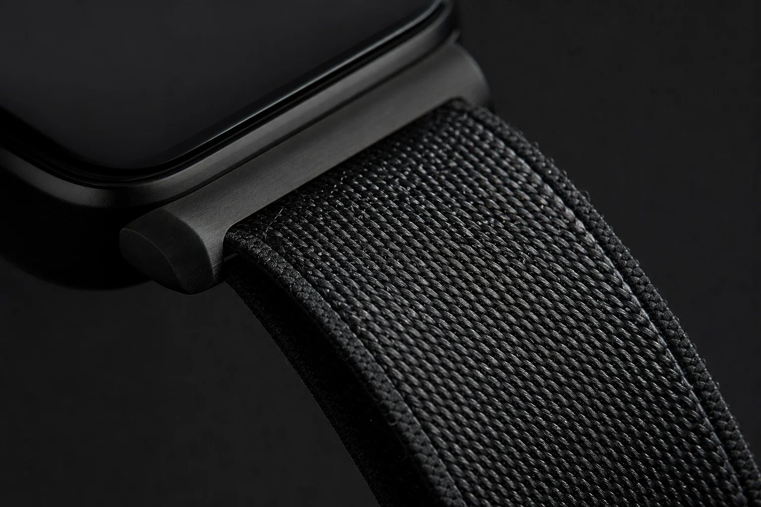 Close-up of the woven CareLink wristband and brushed metal case